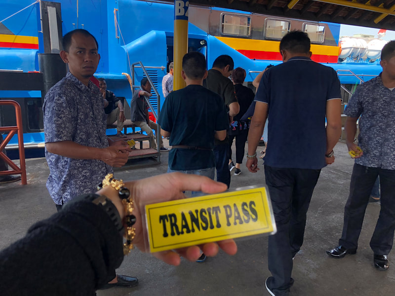 Officers will collect your transit pass, you are not allowed to go into Batam.